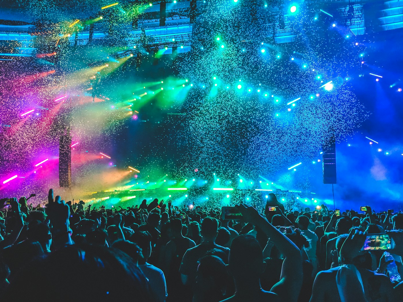 A live concert beneath stage lighting
