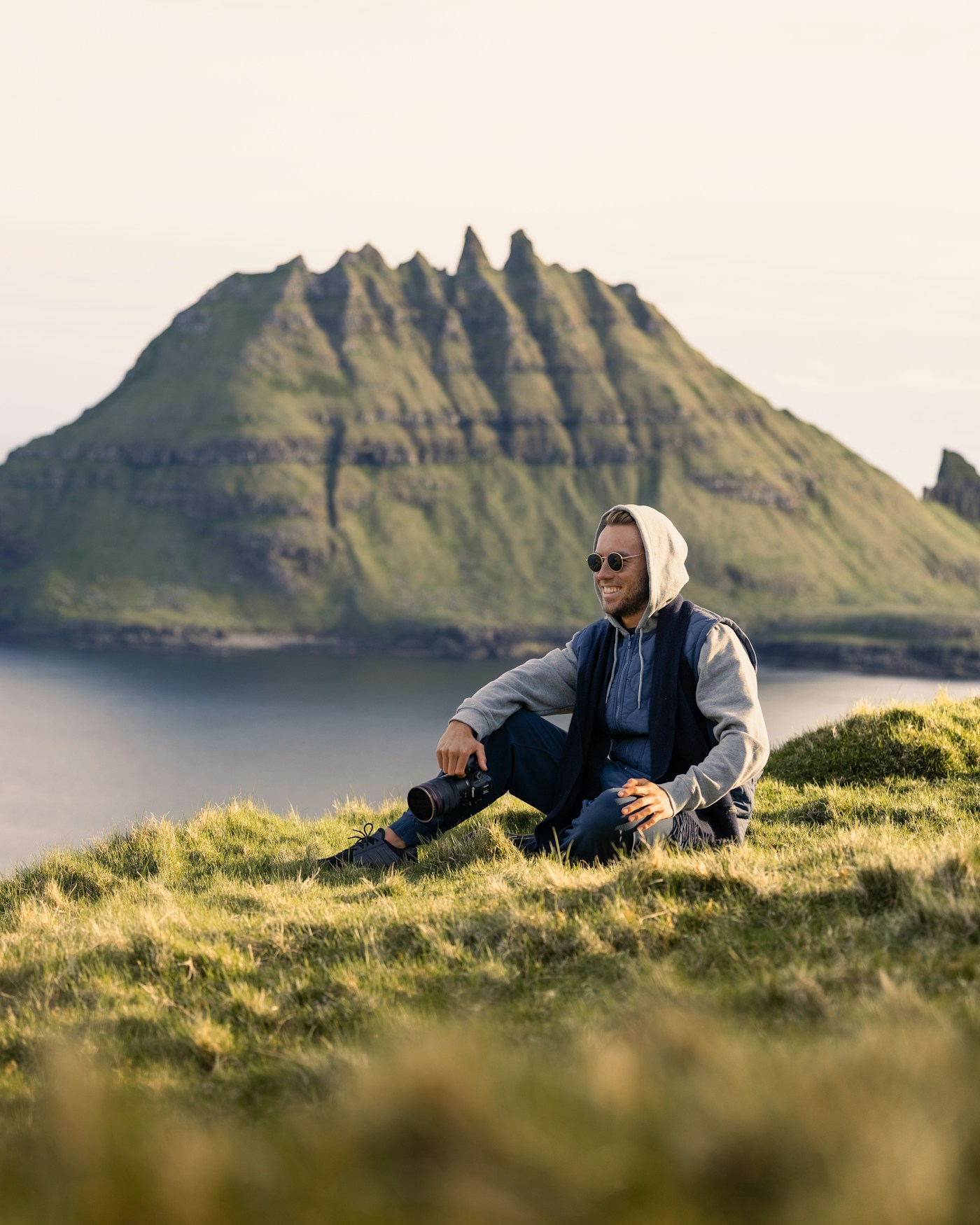 Demo photograph: a photographer holding a camera in an open landscape