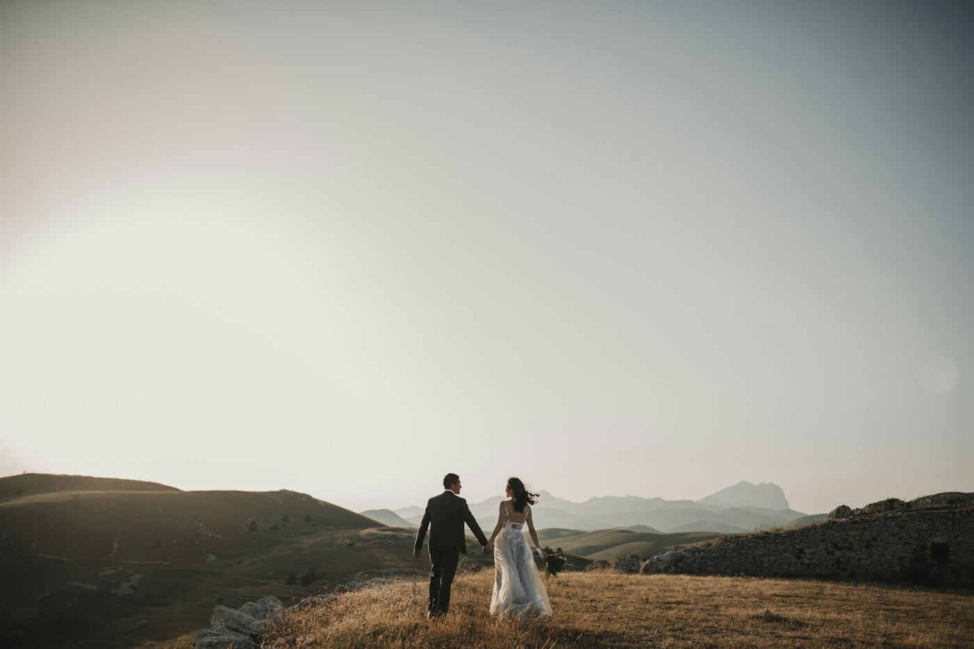 A wedding couple together outdoors